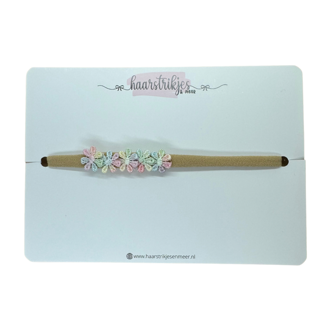 Haarbandje - Pastel regenboog bloemetjes